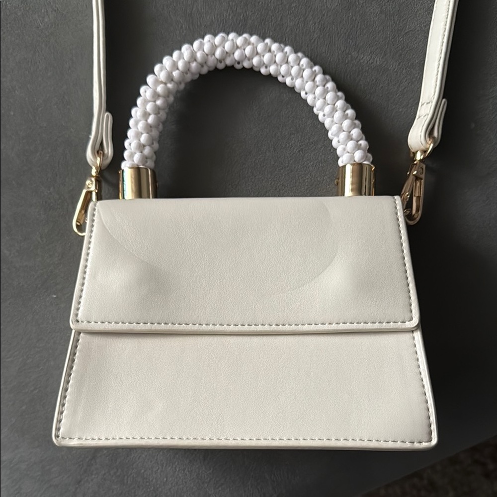 White Handbag with Gold Accents